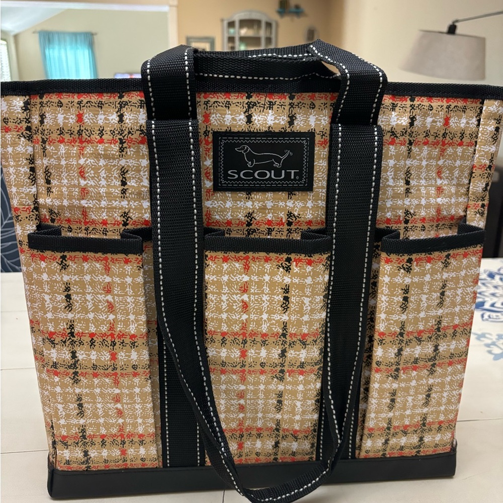 Large gently used Scout bag with multiple outside pockets.